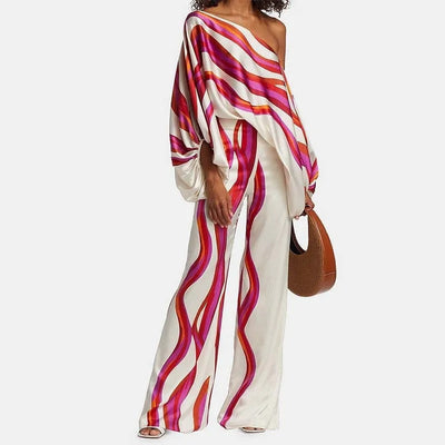 Zweiteiliges damen  set mit asymmetrischem oberteil & weitem bein | satiniertes outfit im retro-style für events & sommer